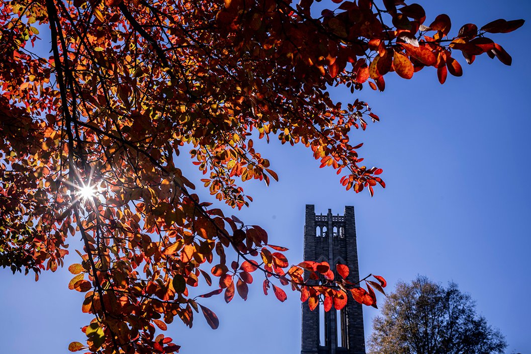 Clothier Bell tower in background, fall foliage in foreground