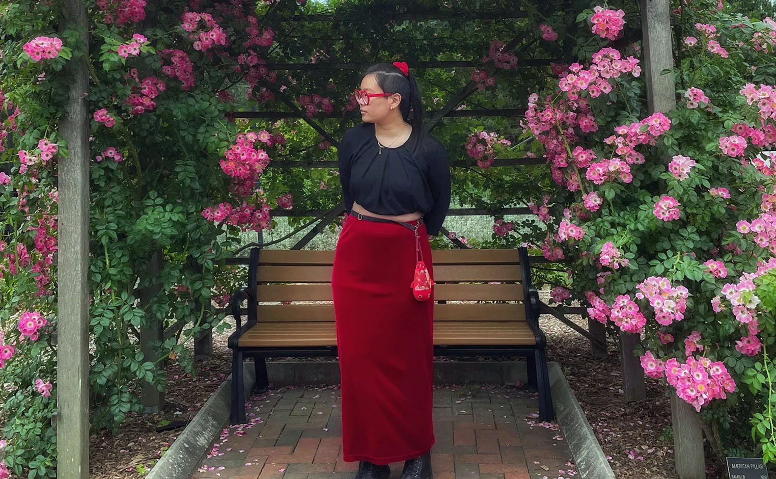 student in rose garden