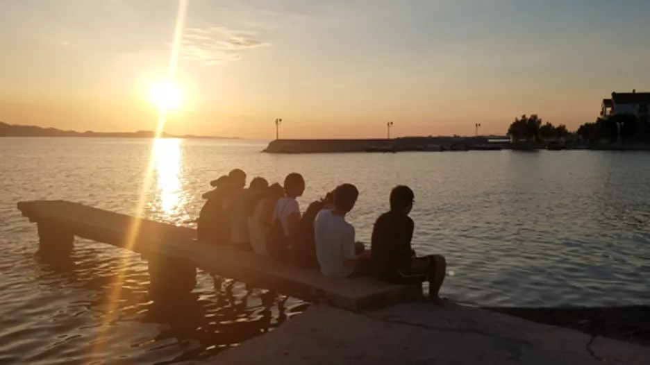 several students at sunset