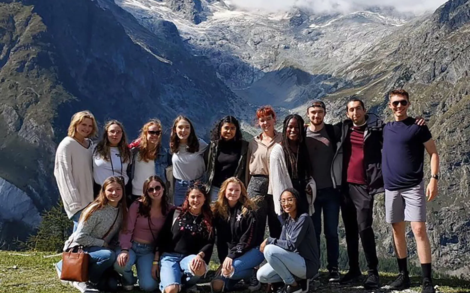 students outside, mountains in the background
