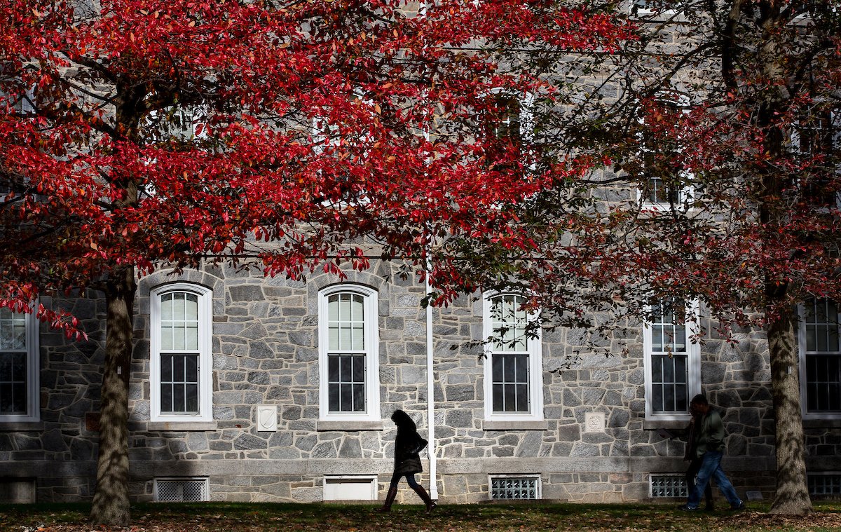 student walking in front of Parrish hall