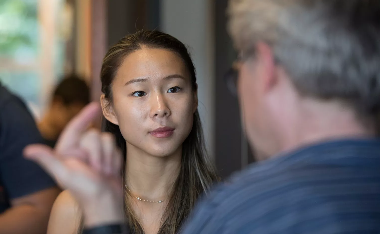 student talking to a professor