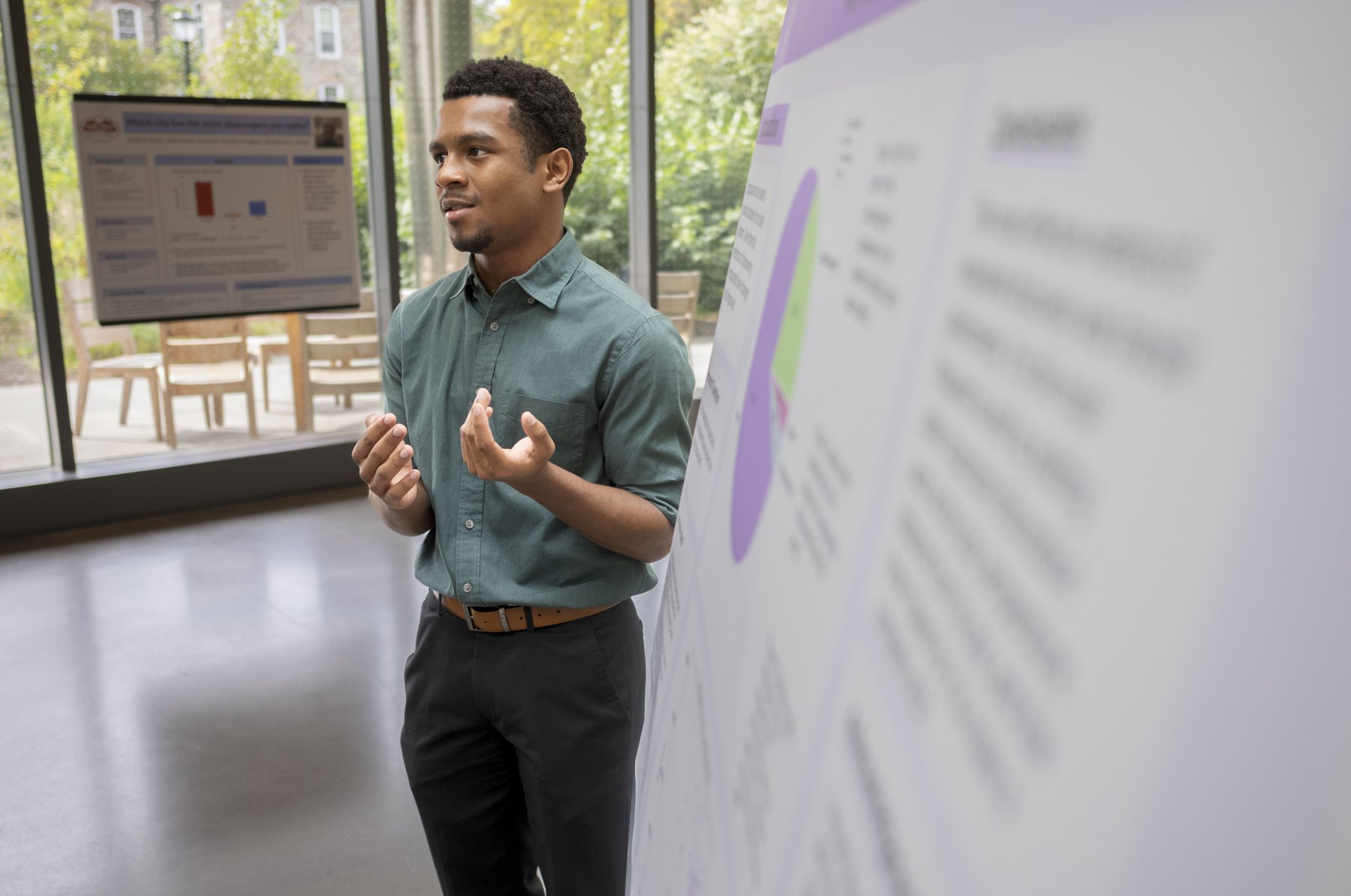 Summer Scholar student presenting research poster