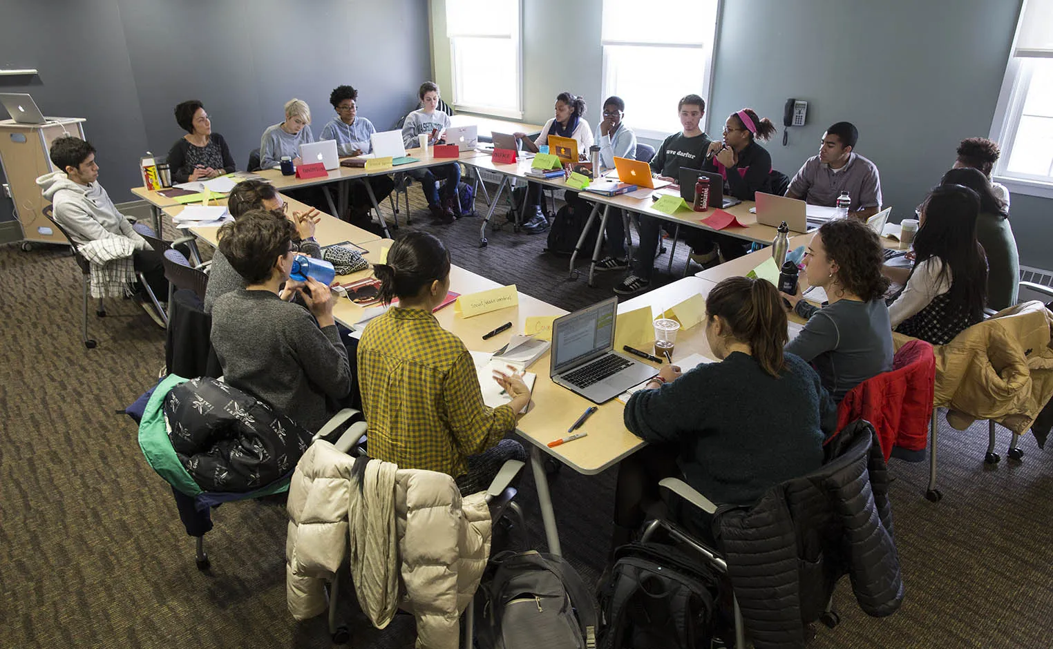 students, faculty and staff in a meeting