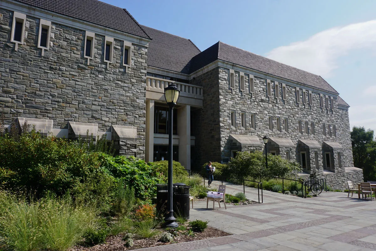 stone building with gardens in front