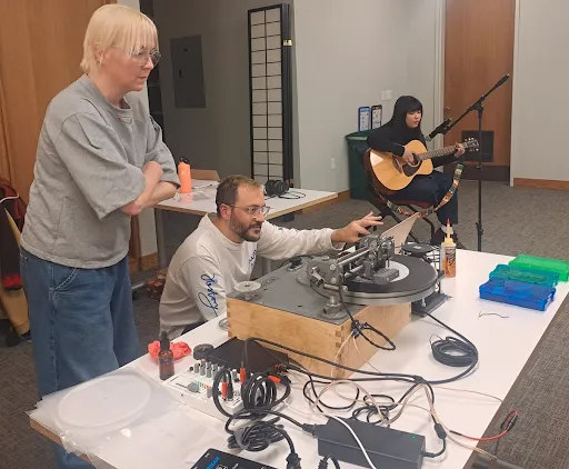 Members of Philadelphia-based arts organization Consonant Collective cut a live recording straight to vinyl record