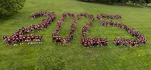 Students spell out "2025" standing outside