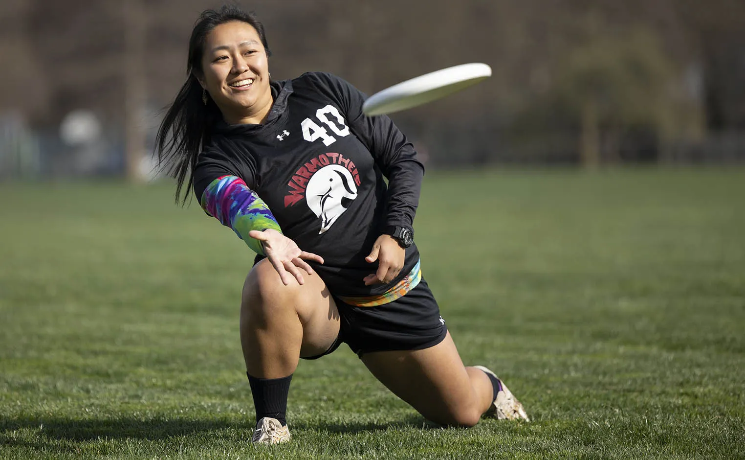 student throwing a frisbee