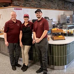Dining staff members pose in newly opened Essie's Corner