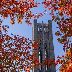 Clothier Belltower surrounded by red and orange leaves