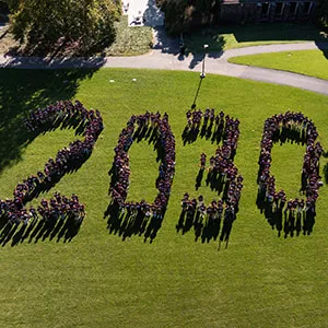 Class of 2030 forms "2030" on outdoor lawn