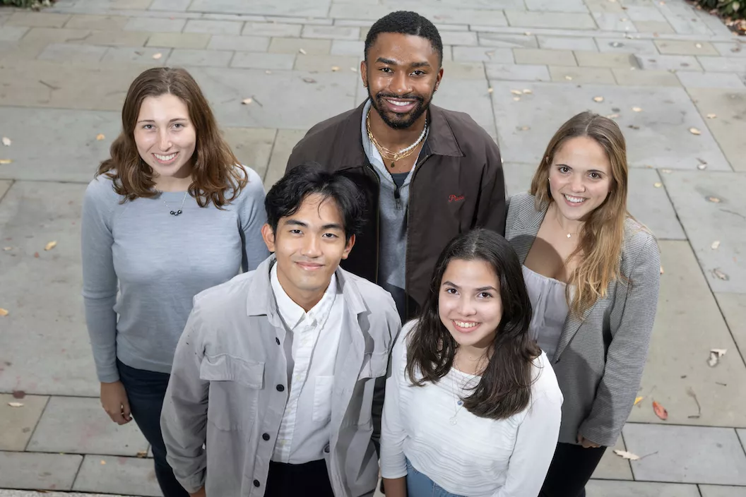 Students pose for group photo outside