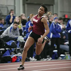 Kenyetta Givans runs on indoor track