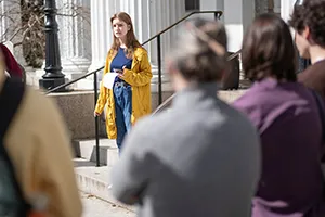 Person speaks to crowd on stairs of Parrish Hall